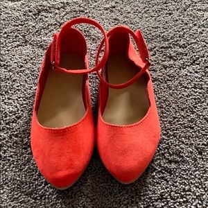 Red scalloped flats with Velcro ankle strap.